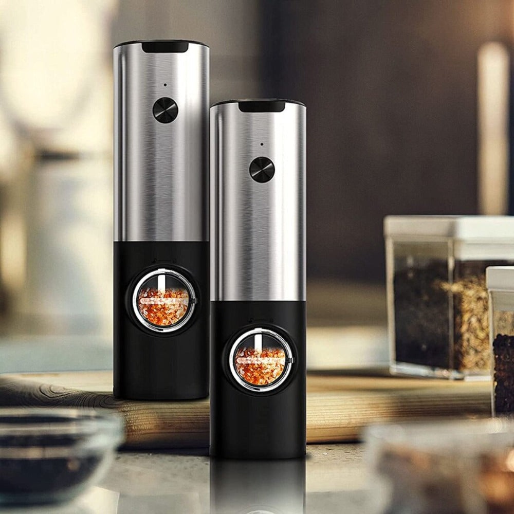 a group of pepper grinders on a counter
