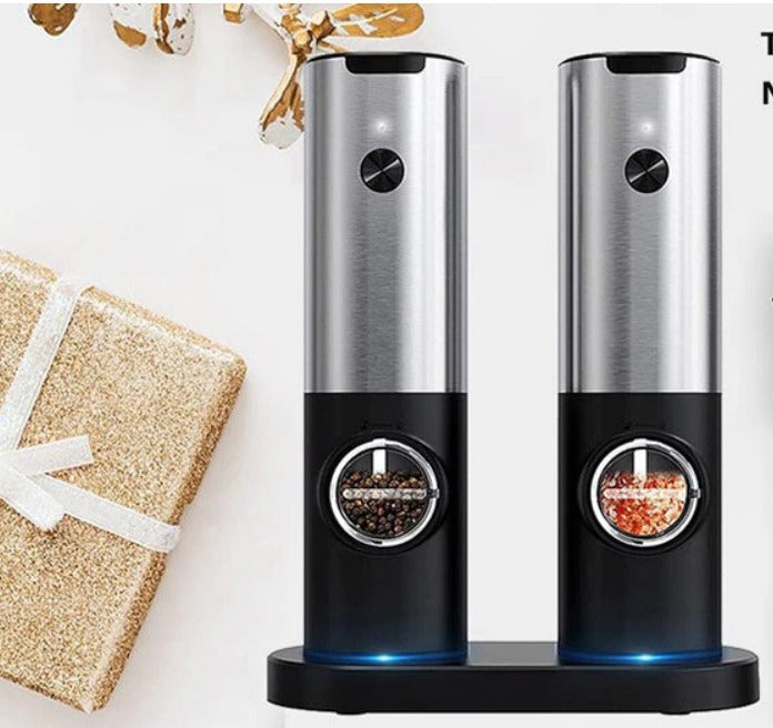 a salt and pepper grinder next to a present