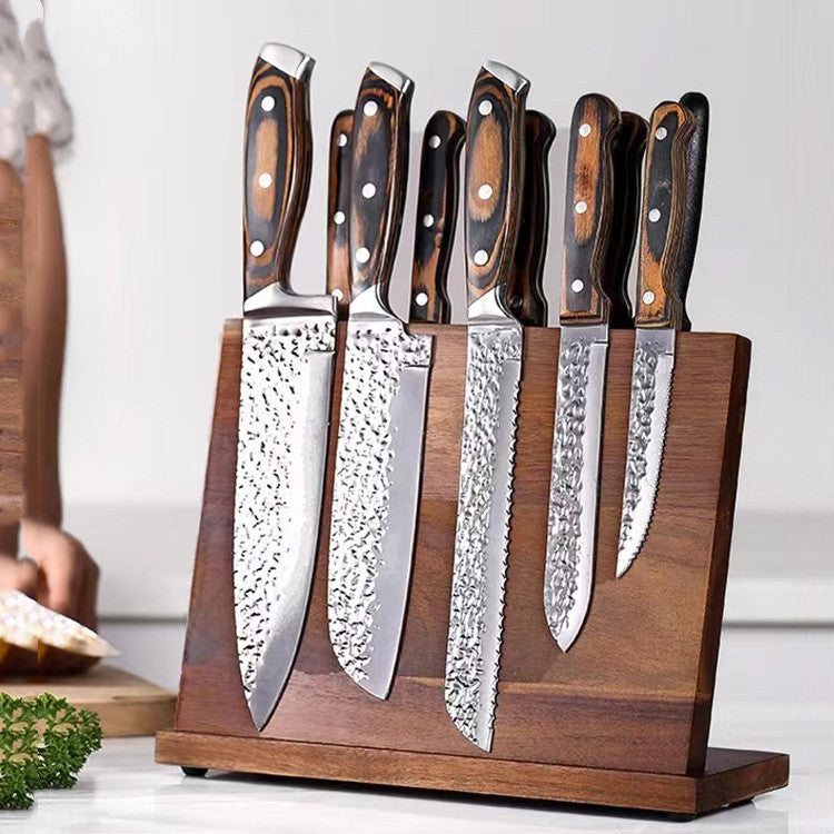 a group of knives in a wooden block