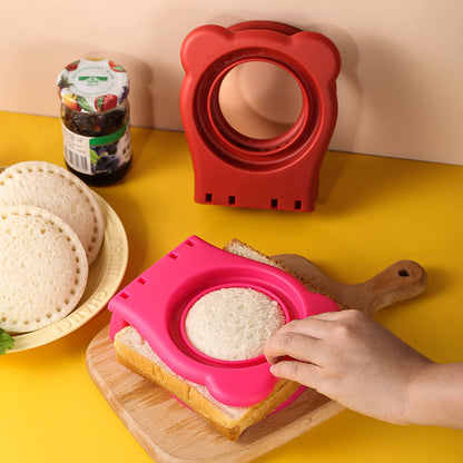 a person using a sandwich cutter with text: '高 三 BONNE'