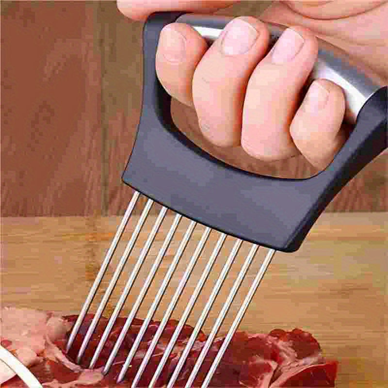 a hand holding a meat cutter