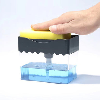 a hand holding a sponge over a container of liquid