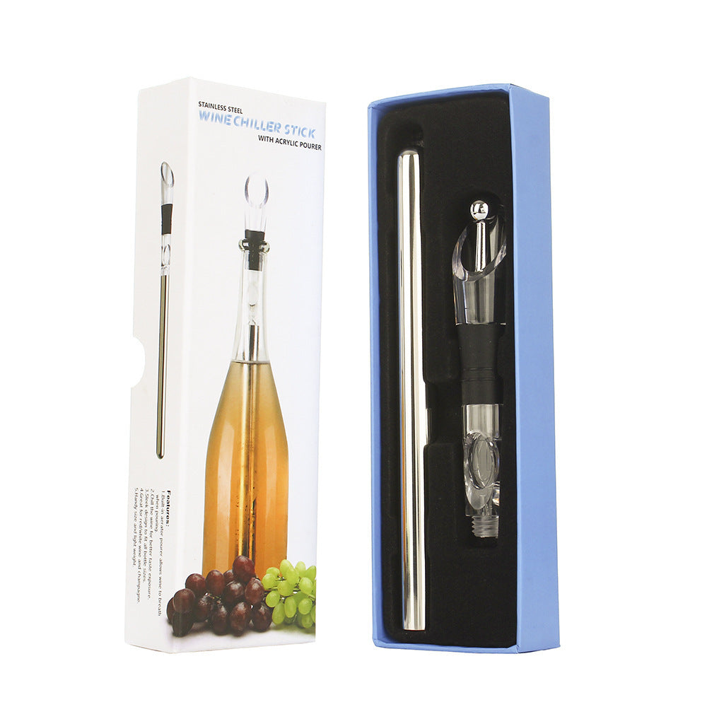 a wine bottle and wine decanter in a box with text: 'WITH ACRYLIC POURER WINE CHILLER STICK STAINLESS STEEL Features: allows to breath when 2.Chill the wine for better to for champagne'