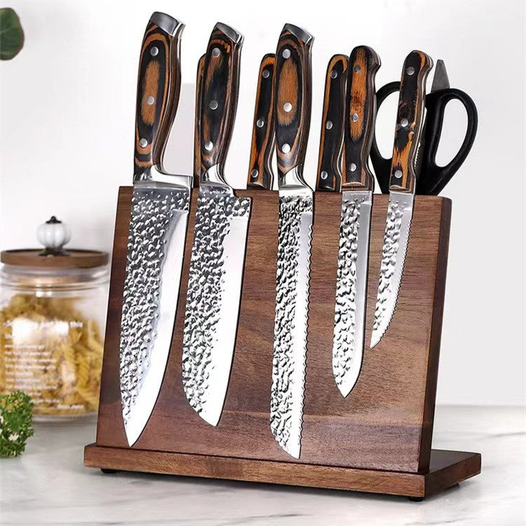 a group of knives in a wooden block