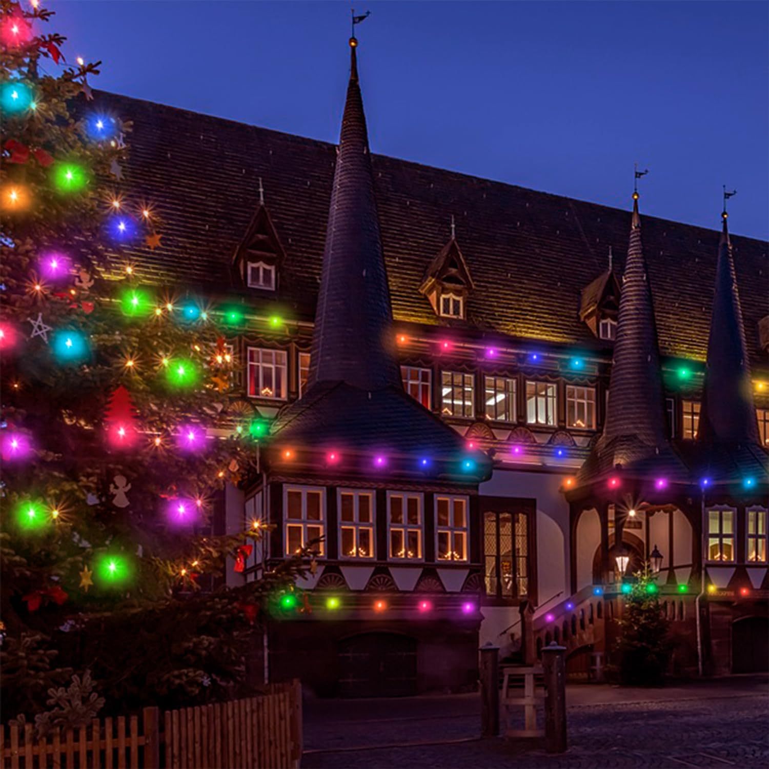 a building with a tree and lights