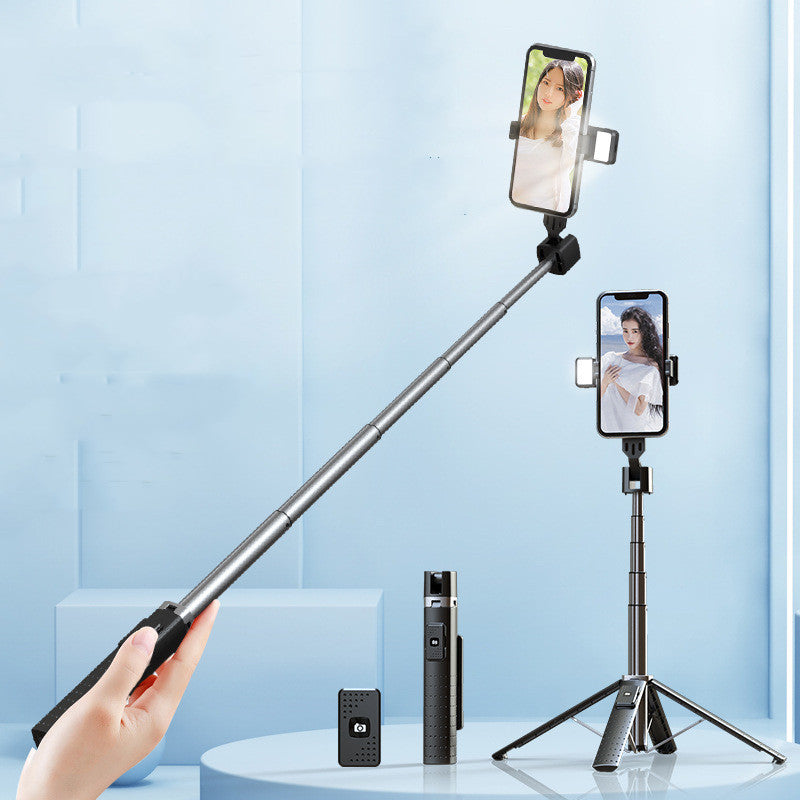 a selfie stick with a hand holding a phone